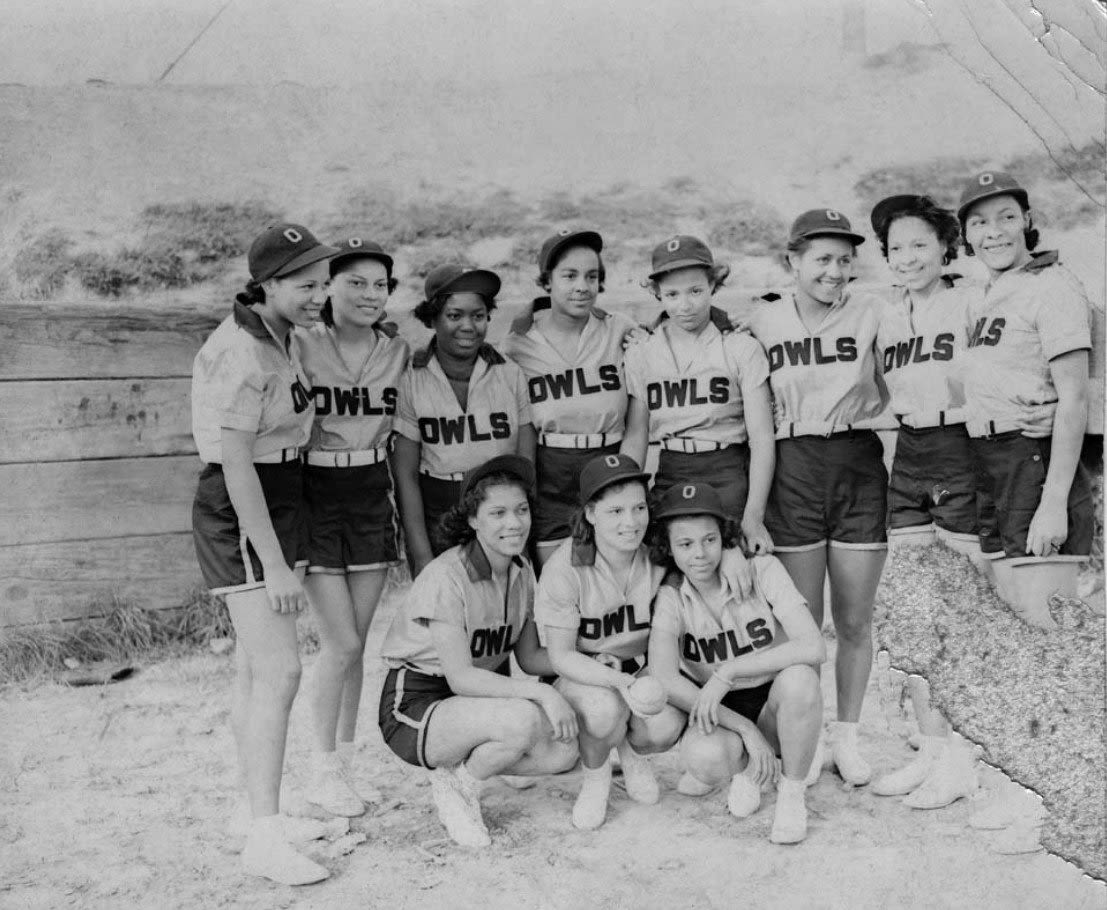 <i>Courtesy of Museum of History & Industry - Al Smith Collection via CNN Newsource</i><br/>Eleven members of the Owls pose for a team photo. A handwritten slip with the photograph identifies the players as