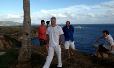 This photo released by the Department of Justice appears to show Howard Lutnick (blue shirt) with Jeffrey Epstein on his private island in the Caribbean.