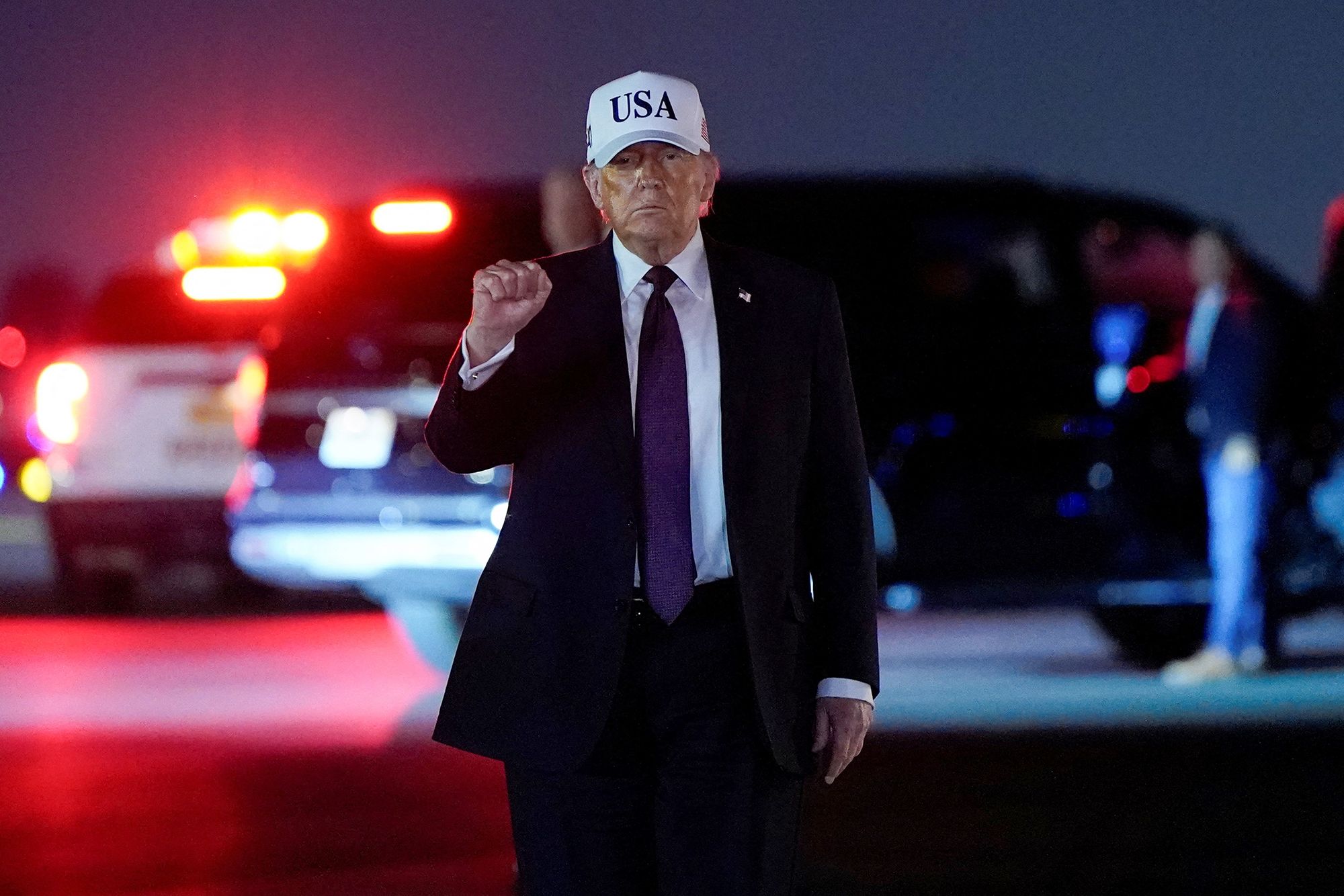 <i>Elizabeth Frantz/Reuters via CNN Newsource</i><br/>US President Donald Trump pumps his fist after disembarking Air Force One at Palm Beach International Airport in West Palm Beach