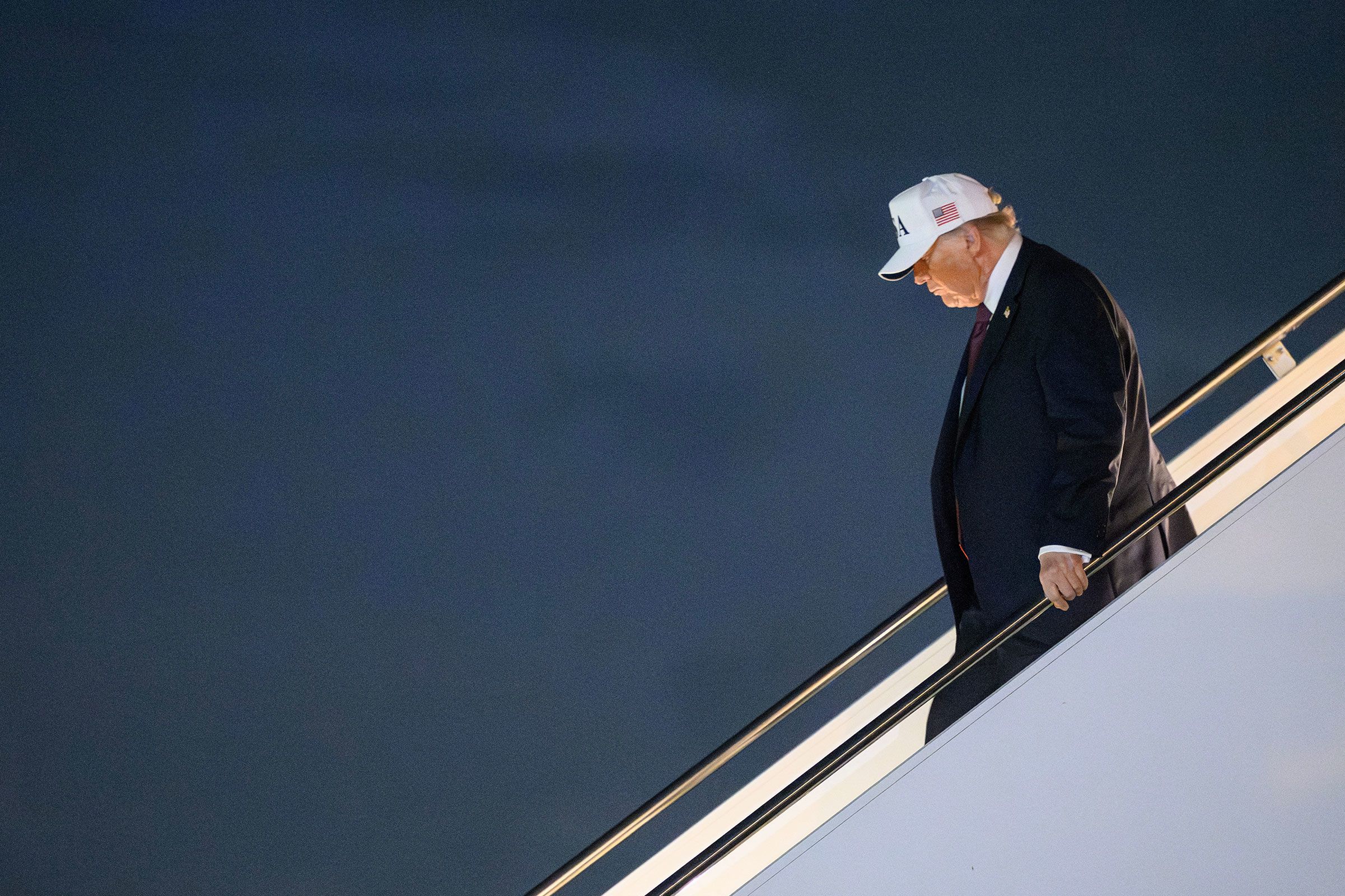 <i>Mandel Ngan/AFP/Getty Images via CNN Newsource</i><br/>US President Donald Trump steps off Air Force One in West Palm Beach