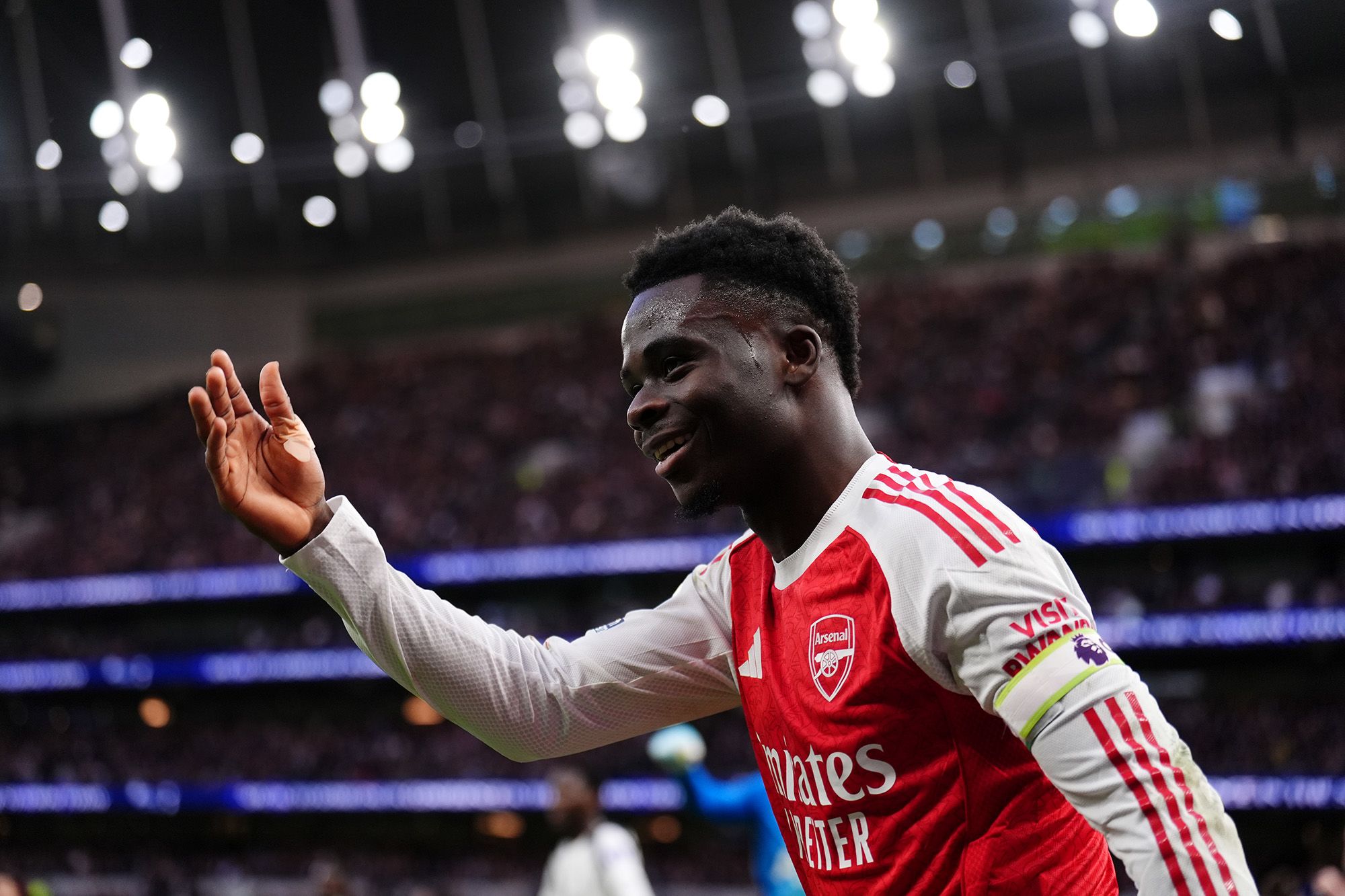 <i>Stuart MacFarlane/Arsenal FC/Getty Images via CNN Newsource</i><br/>Arsenal's Bukayo Saka reads letters of support sent to the club from football fans at London Colney on August 04