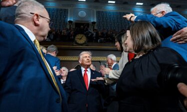 President Donald Trump enters the House chamber to deliver his State of the Union address in Washington