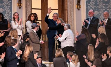 Venezuelan former presidential candidate Enrique Marquez is embraced by his niece during Donald Trump's State of the Union address in Washington