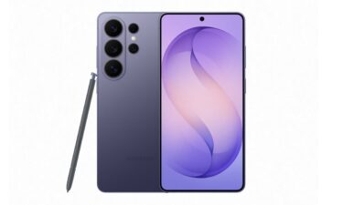 A consumer passes in front of a billboard displaying Apple's newly launched iPhone 17 on September 19