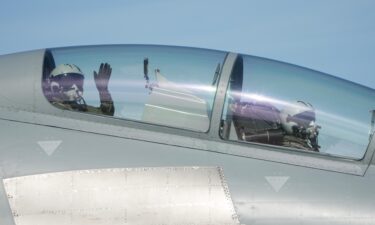 A Lockheed Martin F-35 Lightning II jet performs a flyover before the start of the Rolex 24 at Daytona International Speedway in Daytona Beach