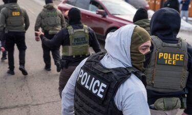 Federal agents conduct immigration enforcement operations earlier this month in Minneapolis.