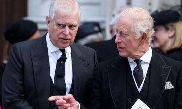 Andrew Mountbatten-Windsor speaks with King Charles as they leave Westminster Cathedral in London in September.