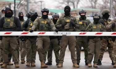 US Border Patrol agents stand guard at the Bishop Henry Whipple Federal Building in Minneapolis
