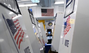Voting booths are set up in a polling place in the West Village of New York on October 30