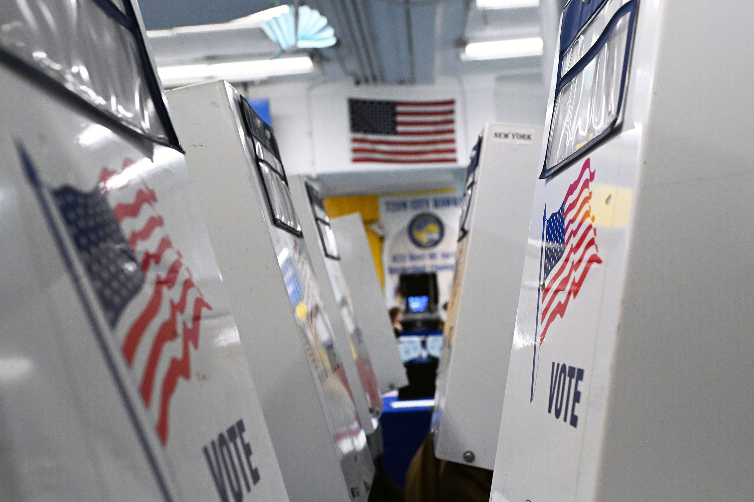 <i>Andrea Renault/STAR MAX/IPx/AP via CNN Newsource</i><br/>Voting booths are set up in a polling place in the West Village of New York on October 30