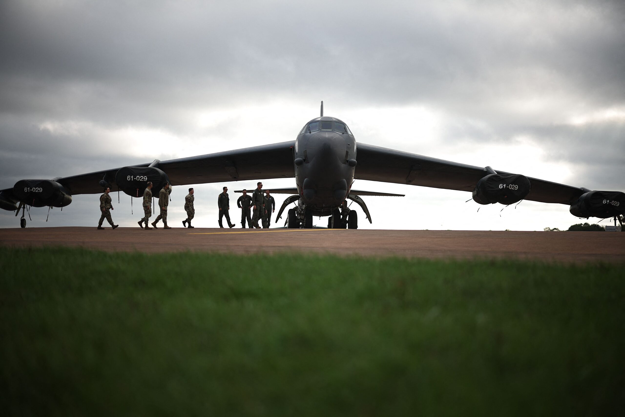 <i>HENRY NICHOLLS/AFP/AFP via Getty Images via CNN Newsource</i><br/>Flight crew from US Air Force 501st Combat Support Wing and 307th Bomb Wing walk towards a B-52 Stratofortress bomber aircraft at RAF Fairford on September 19