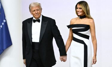 Melania Trump enters an inaugural ball in 2025