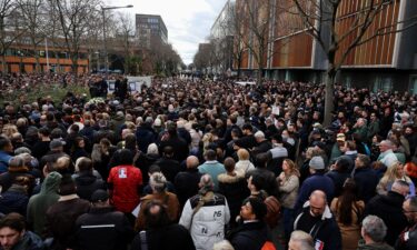 People gather February 21 for a march in tribute to Quentin Deranque