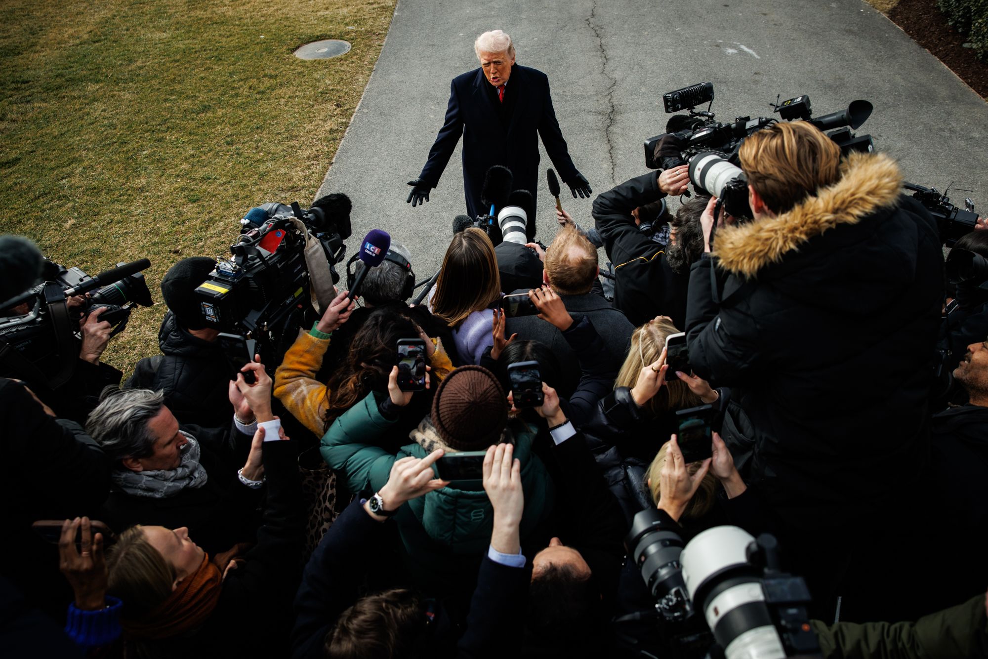 <i>Samuel Corum/Sipa USA/AP via CNN Newsource</i><br/>President Donald Trump speaks to reporters on the South Lawn of the White House on January 16.