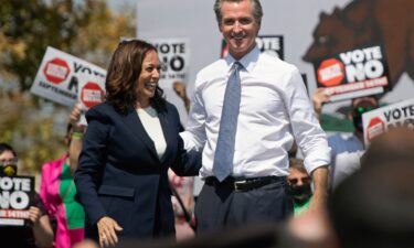 Former US Vice President Kamala Harris (left) stands with California Governor Gavin Newsom during a campaign event in San Leandro