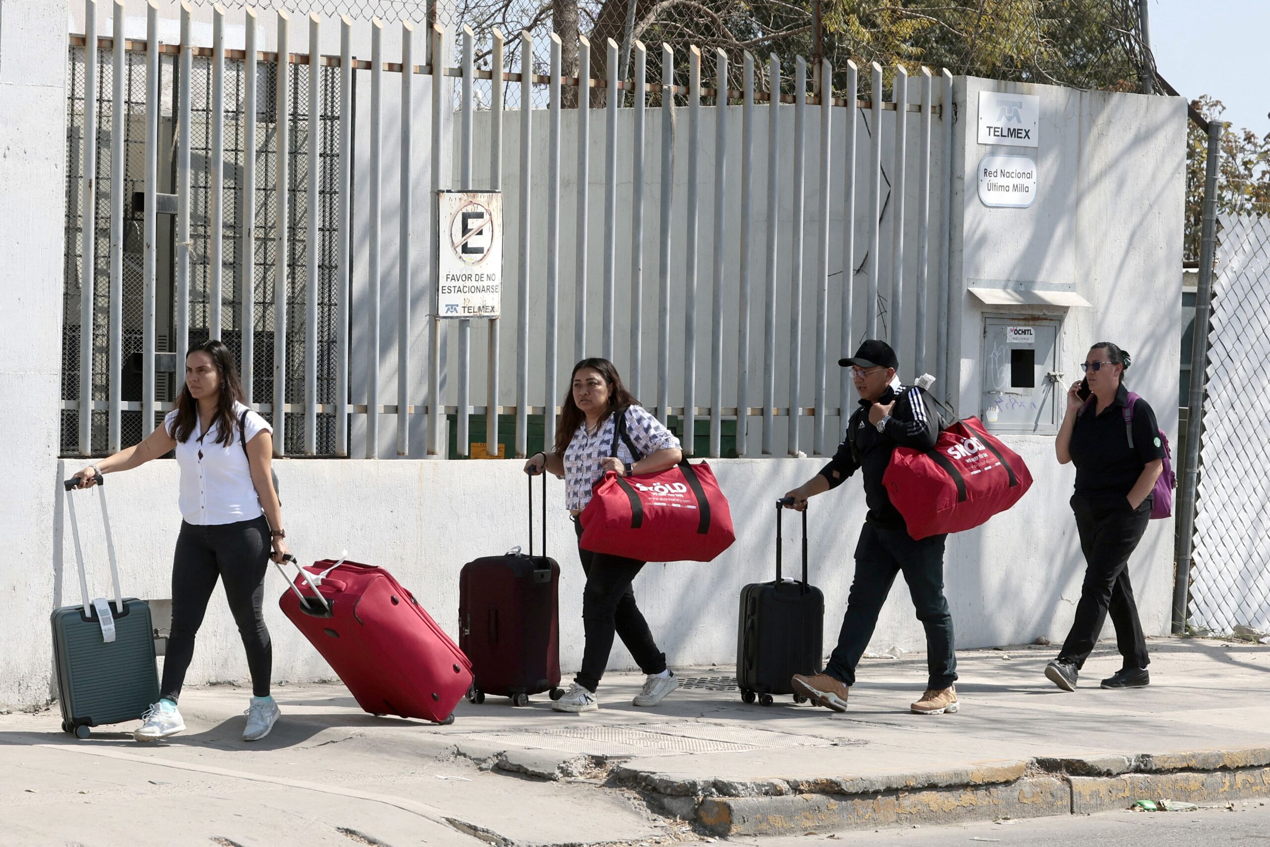 <i>Ulises Ruiz/AFP/Getty Images via CNN Newsource</i><br/>Passengers leave Guadalajara International Airport in Tlaquepaque