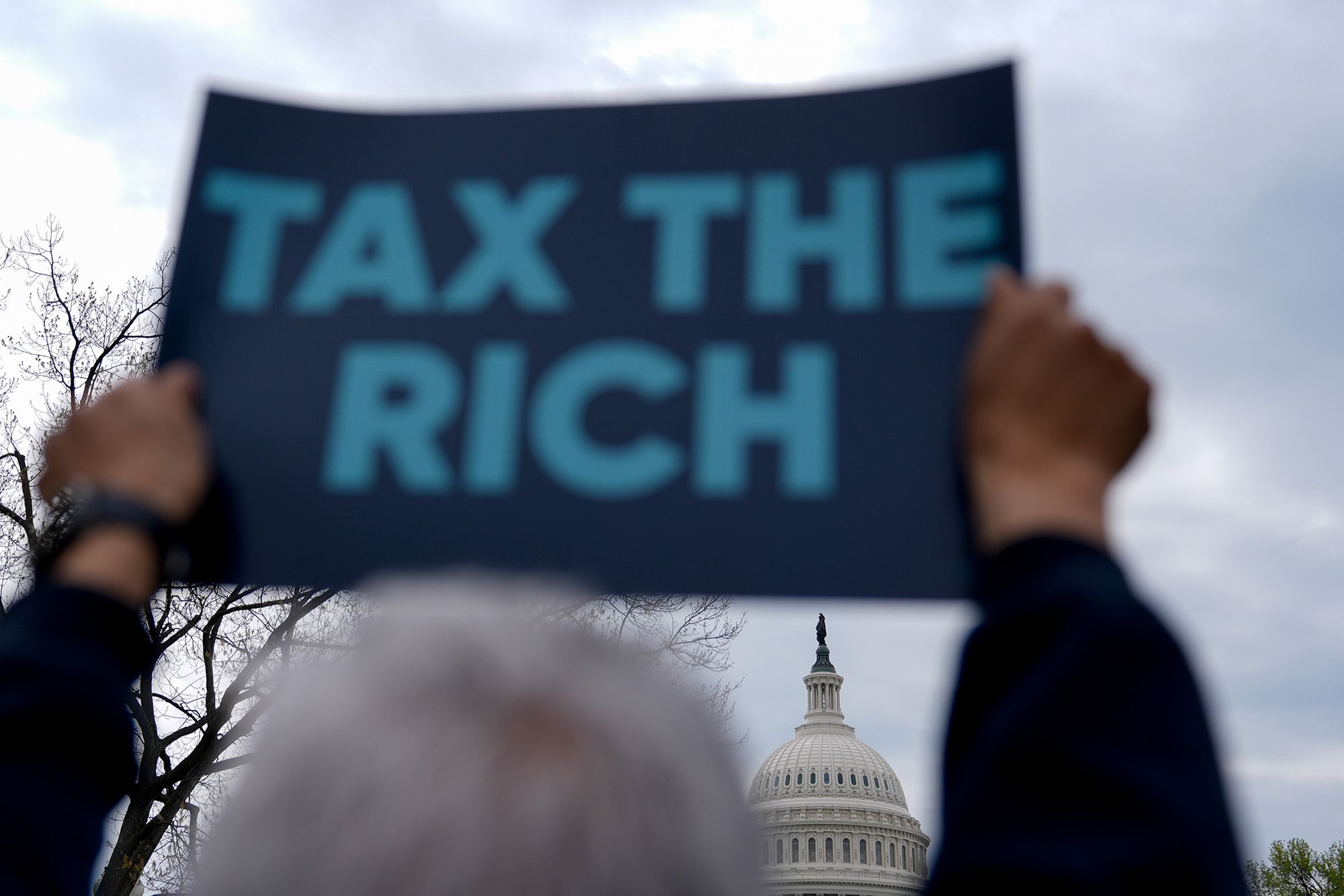 <i>Kent Nishimura/Bloomberg/Getty Images via CNN Newsource</i><br/>A demonstrator holds a 