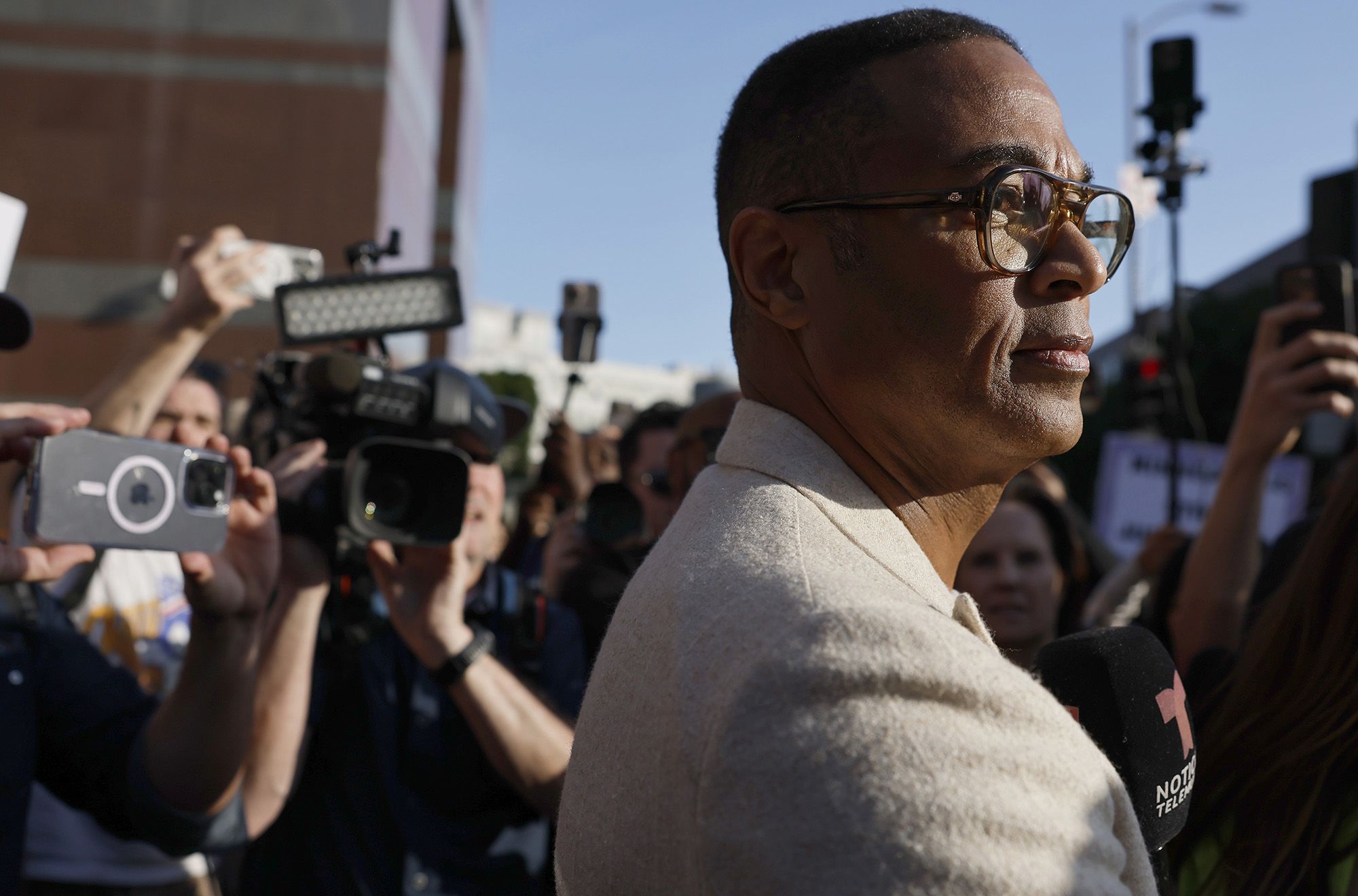 <i>Mario Tama/Getty Images via CNN Newsource</i><br/>Journalist Don Lemon speaks to reporters outside federal court in Los Angeles on January 30