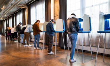 A sign is displayed outside of the Robert F. Kennedy Department of Justice building in Washington
