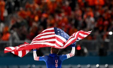 Jordan Stolz celebrates after winning gold in the men's 500m.