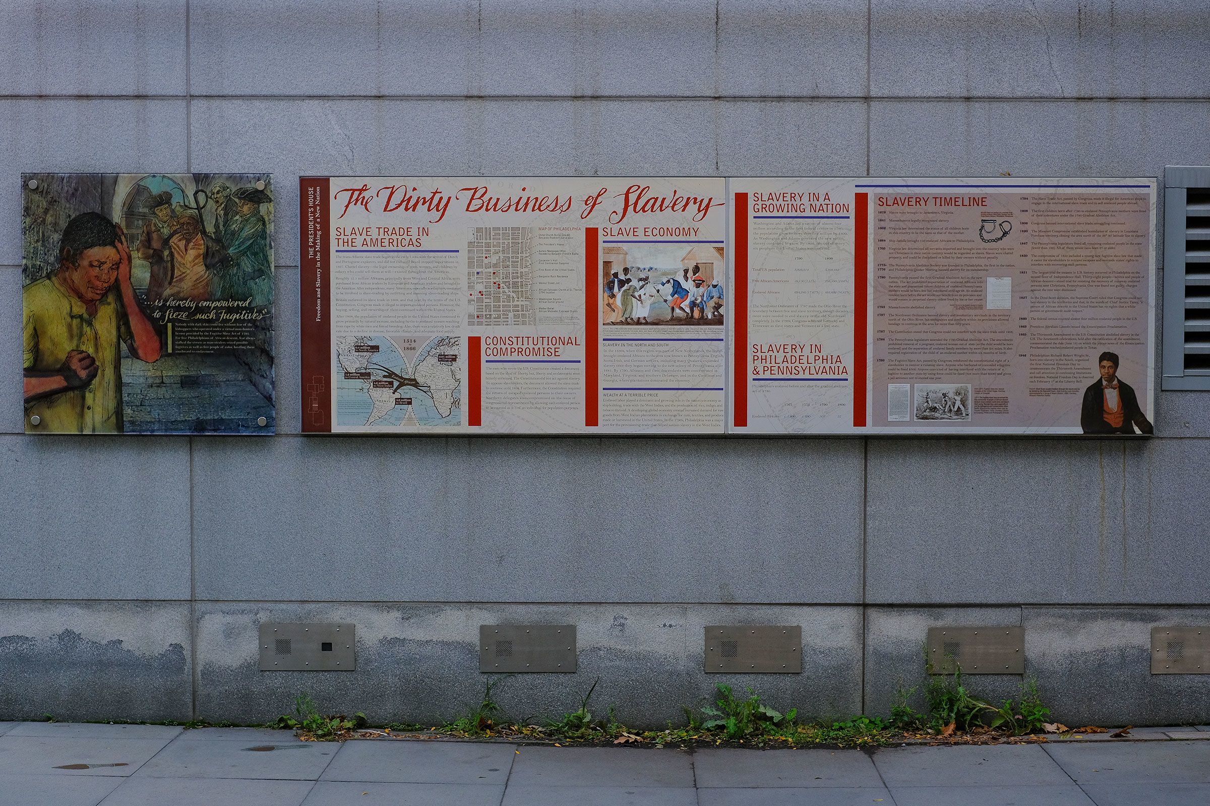 <i>Michael Yanow/NurPhoto/Getty Images/File via CNN Newsource</i><br/>Signage about slavery is displayed on an outdoor exhibit at Independence National Historical Park in Philadelphia