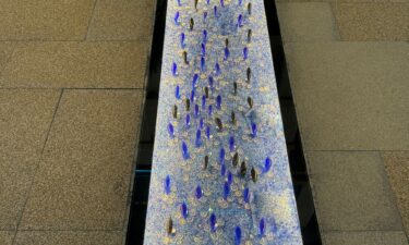 The waterfront promenade on Gewan is framed by glass trees inspired by artist Dale Chihuly.