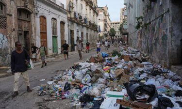 People watch the oil tanker Ocean Mariner