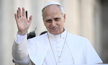 Pope Leo XIV waves to the crowd during the weekly general audience at St Peter's Square in The Vatican on February 18