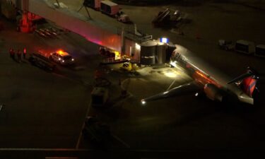 First responders are seen near a plane following an emergency landing in Houston