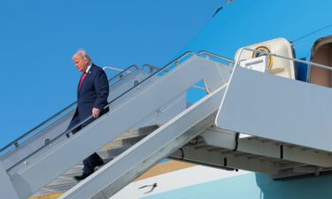 President Donald Trump departs Air Force One after arriving at Palm Beach International Airport in West Palm Beach