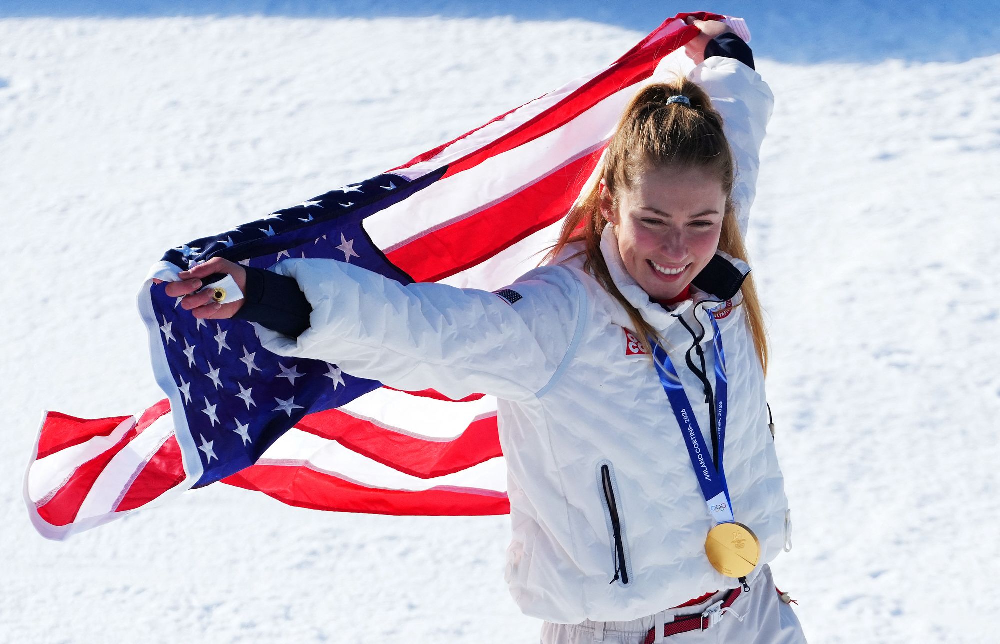 <i>Robert F. Bukaty/AP via CNN Newsource</i><br/>Shiffrin sits on the side of the course after skiing out in the first run of the women's slalom at the 2022 Winter Olympics.