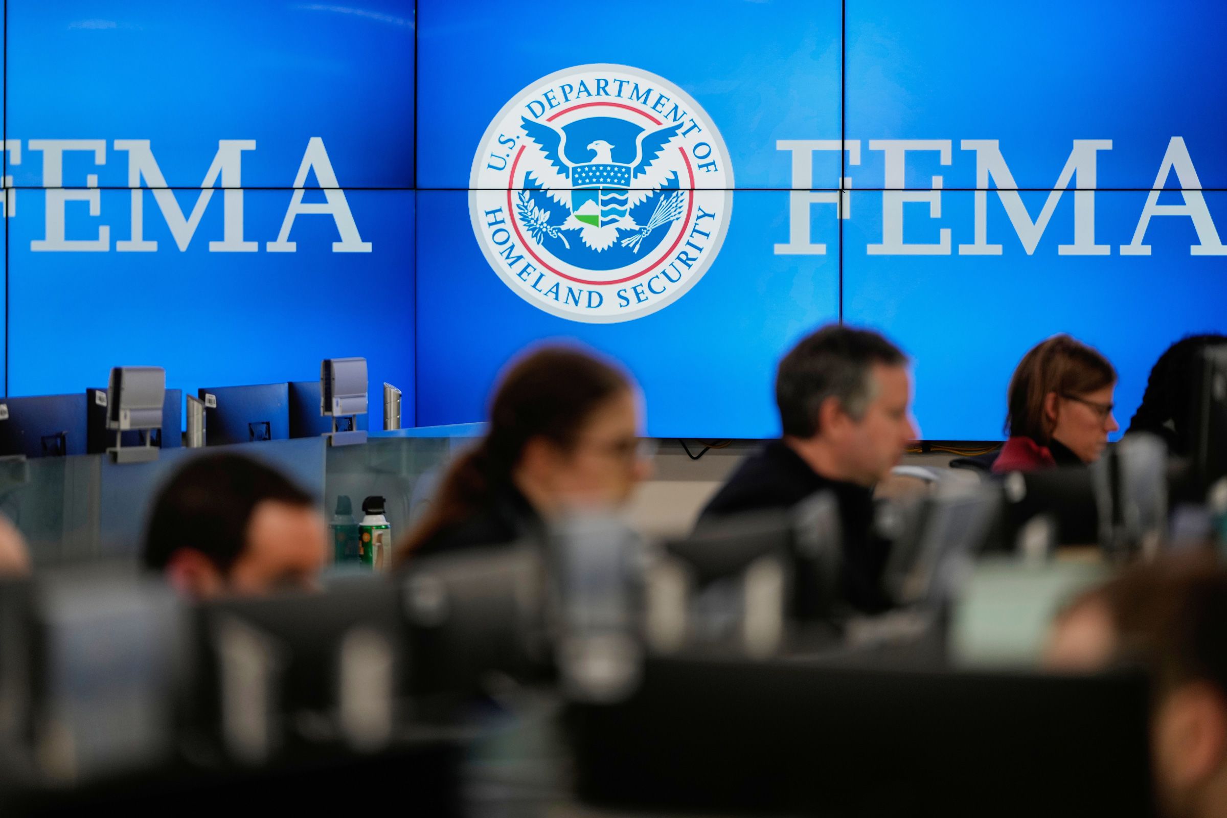 <i>Julia Demaree Nikhinson/AP via CNN Newsource</i><br/>People work at the Federal Emergency Management Agency headquarters in Washington