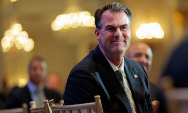 Oklahoma Gov. Kevin Stitt is introduced by David Rubenstein