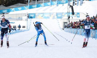 Biathletes ski to end of race together.