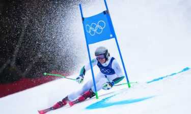 A skier on a giant slalom course