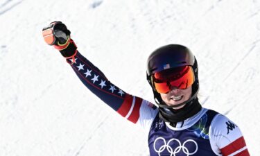 Mikaela Shiffrin raises a fist in the air after winning gold in the women's slalom.