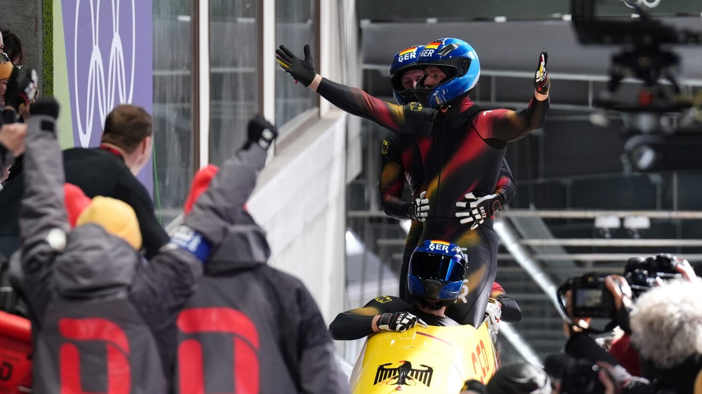 <i>NBC Olympics</i><br/>Johannes Lochner celebrates in sled after final run