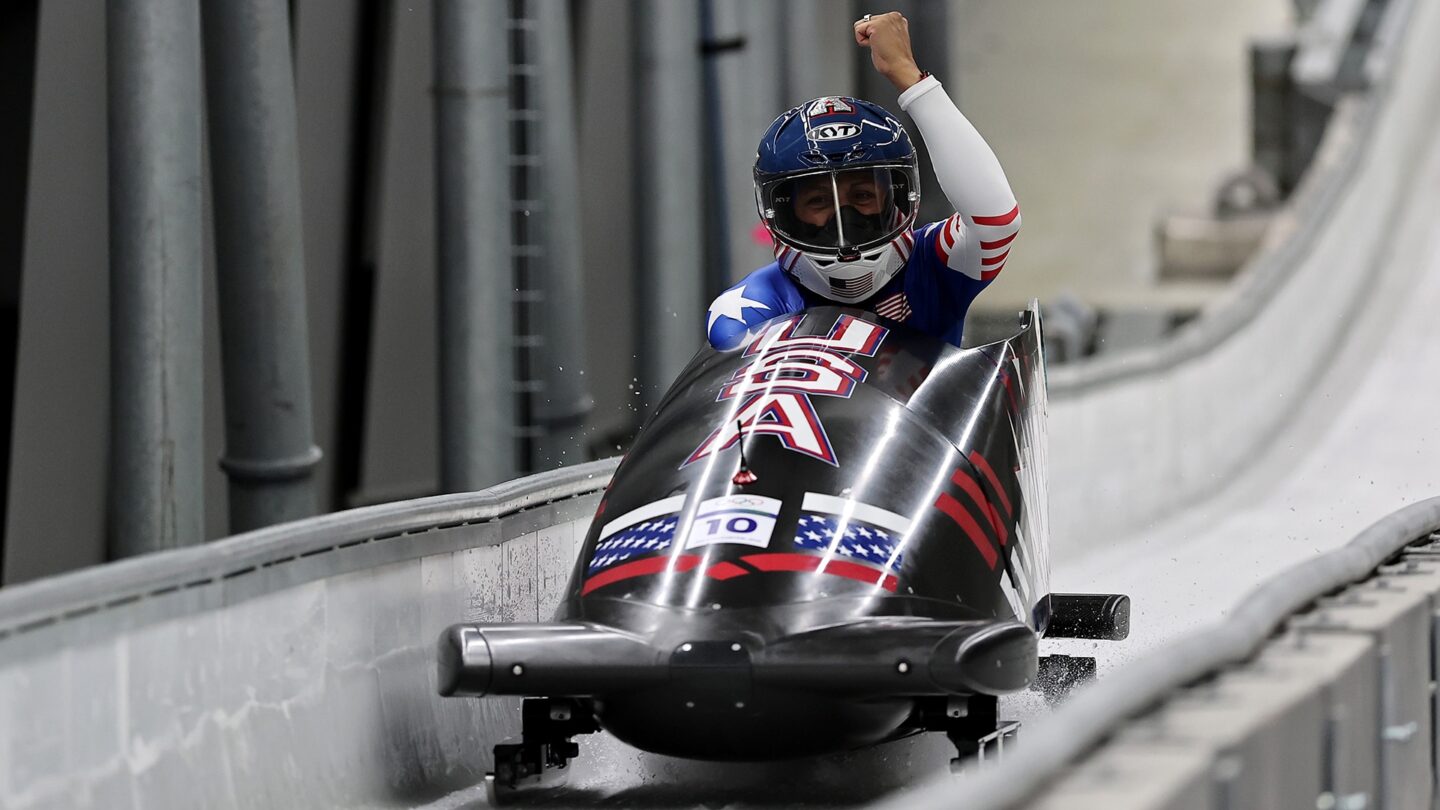 Elana Meyers Taylor pumps her fist in monobob sled