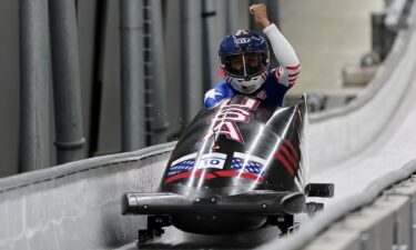 Elana Meyers Taylor pumps her fist in monobob sled