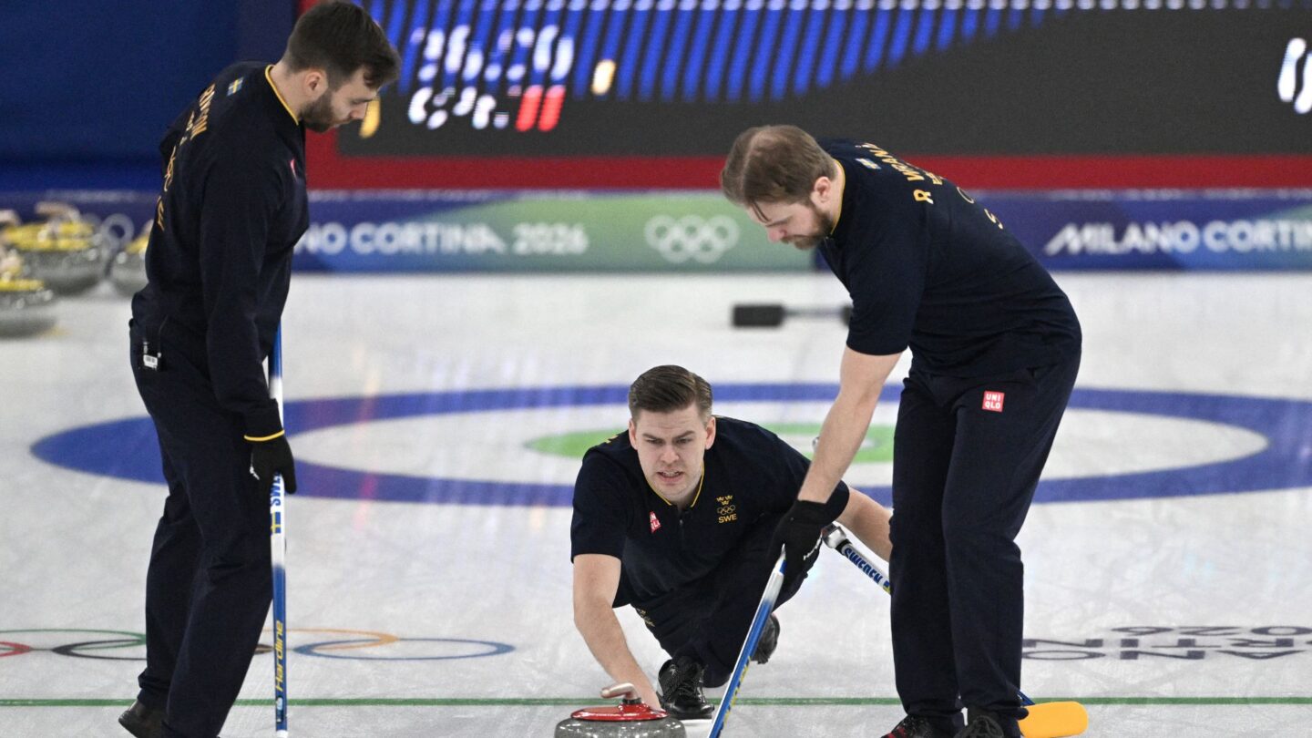 Swedish curlers come down the ice