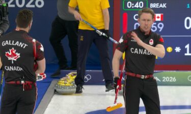 Canadian curler Marc Kennedy angrily comes down the ice