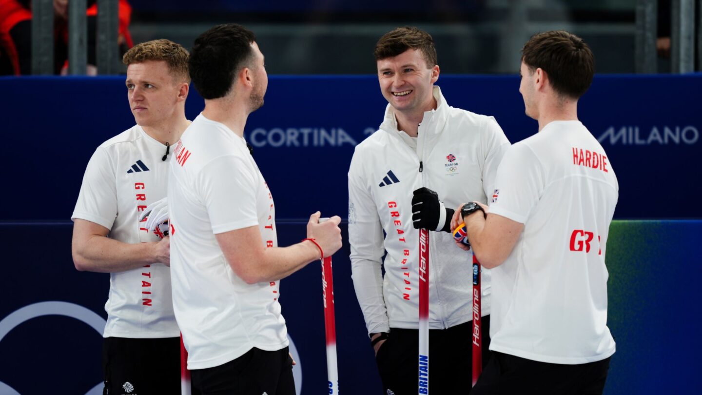 Great Britain curlers huddle