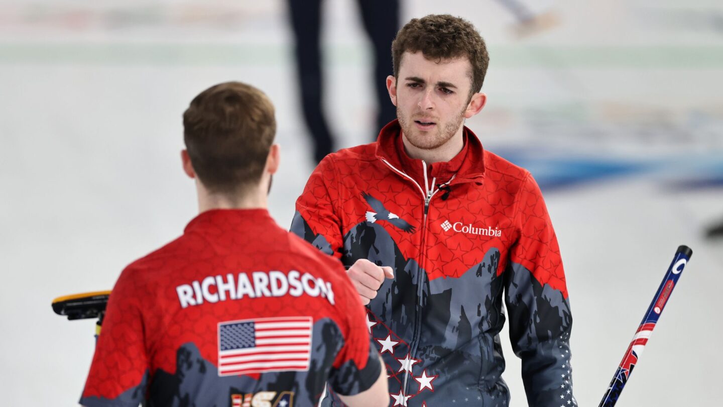 USA men's curler Danny Casper fist bumps his teammate