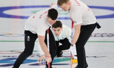 Great Britain sweepers come down the ice