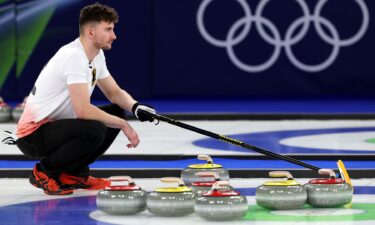 German curler squats on ice
