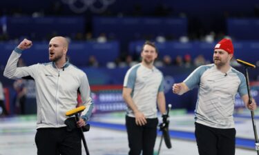 Norway curlers wave to the crowd
