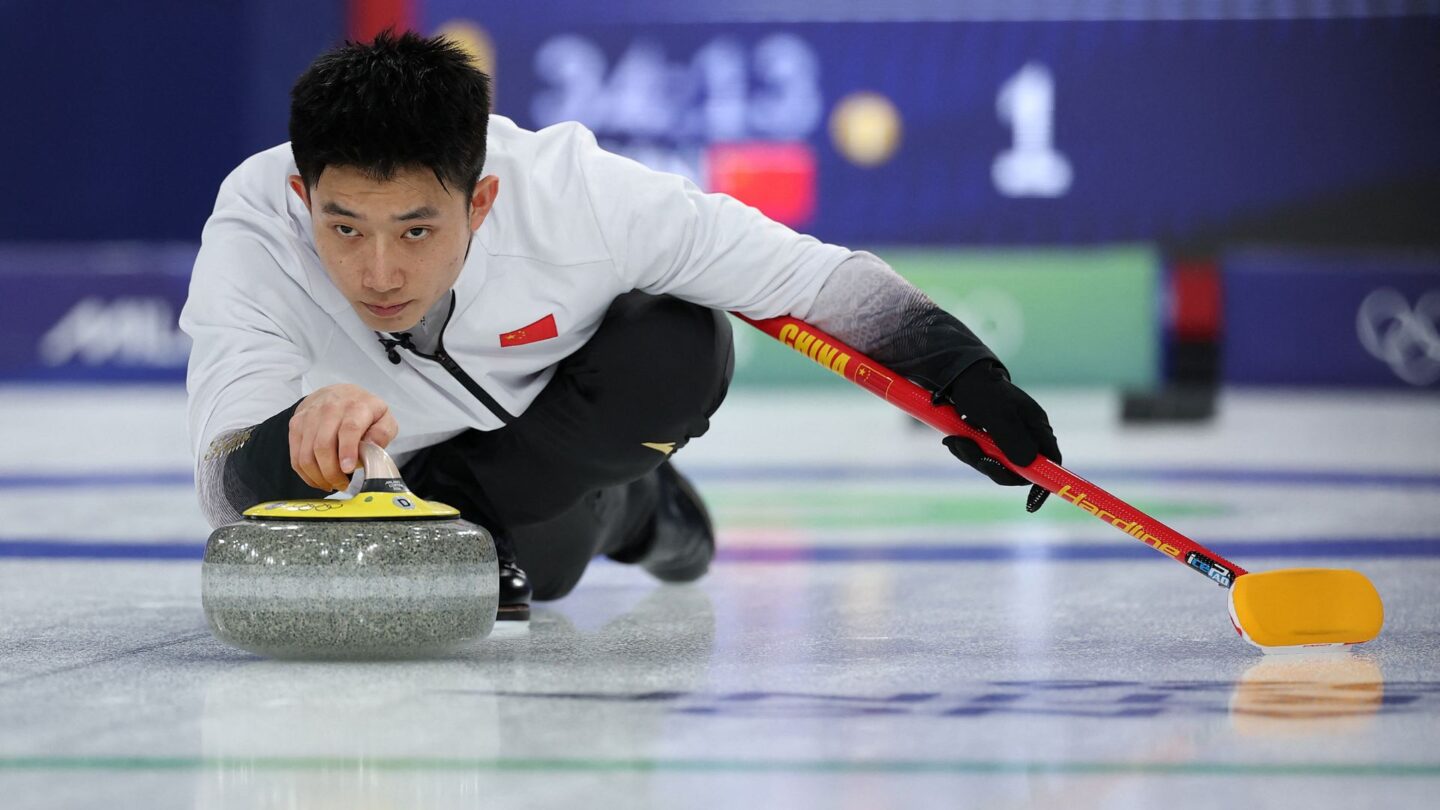 Chinese curler comes down the ice