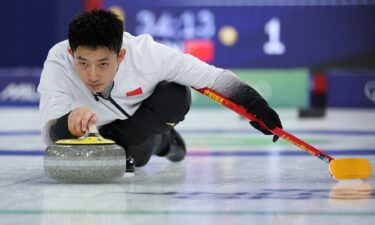Chinese curler comes down the ice
