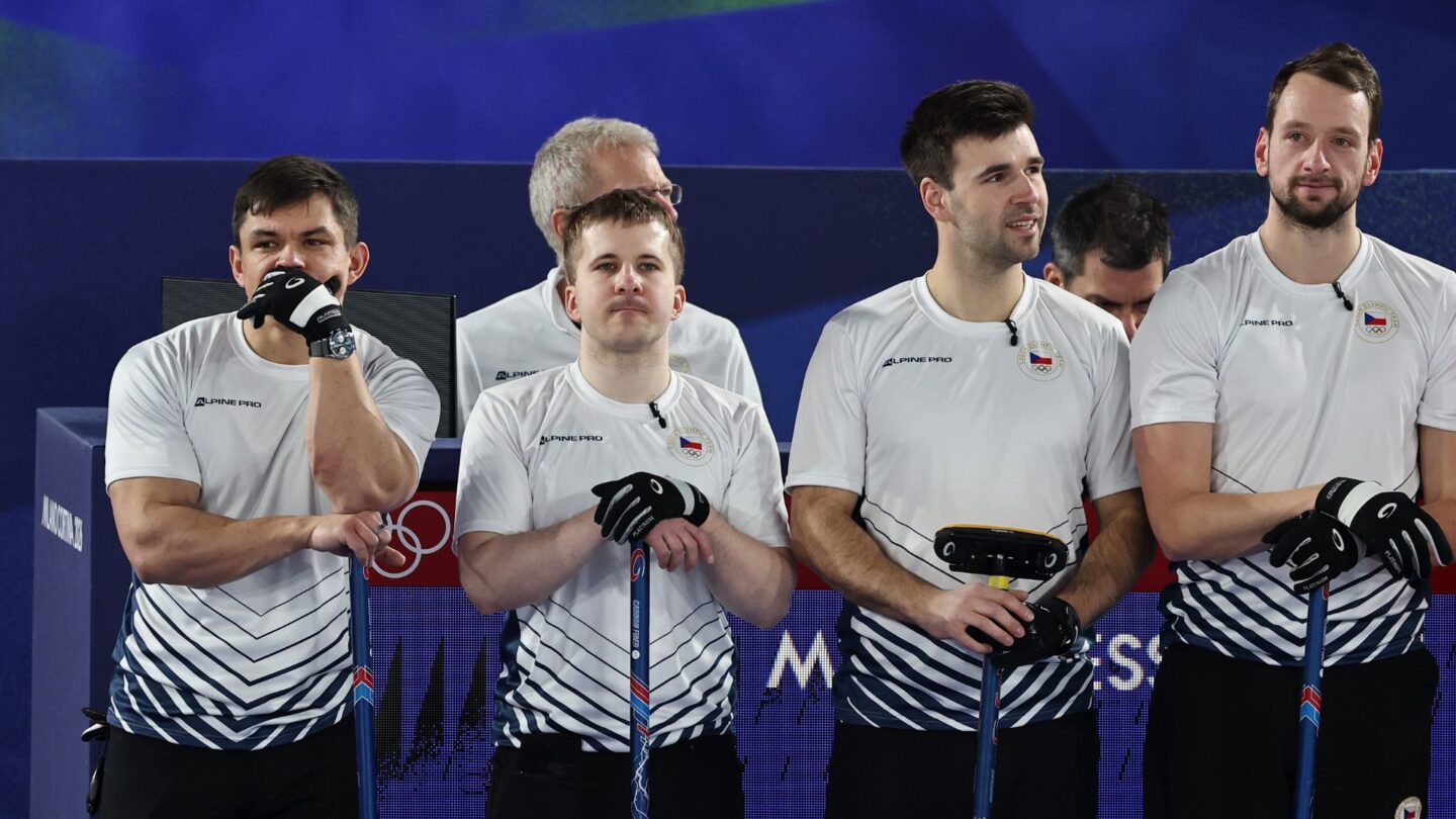 <i>NBC Olympics</i><br/>Czechia curlers stand over their brooms