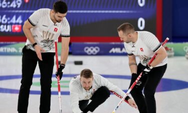 Swiss curlers come down the ice